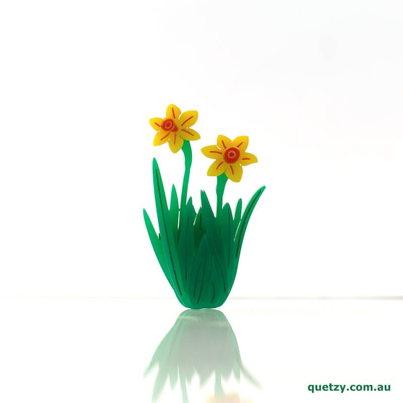 Daffodil acrylic brooch. Designed, laser cut and handmade by Quetzy.