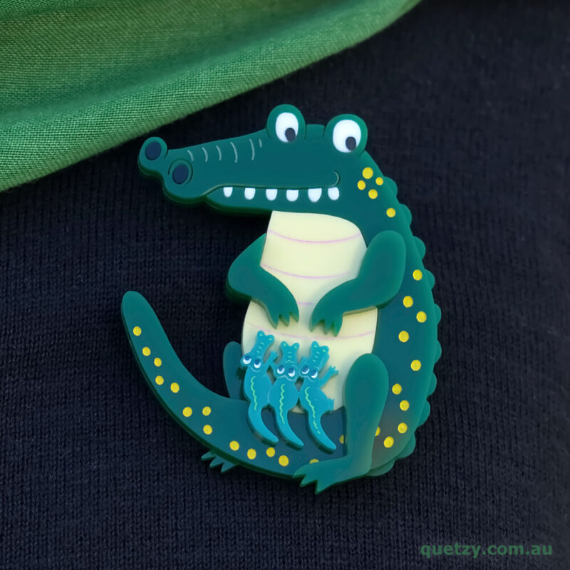 Crocodillius acrylic brooch. Designed, laser cut and handmade by Quetzy.