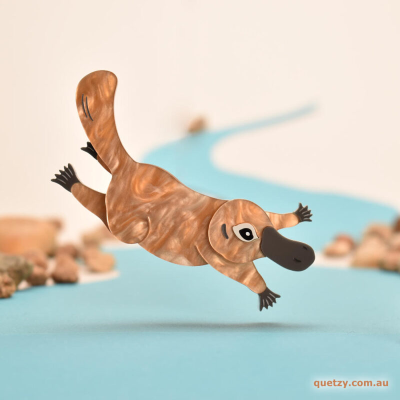 Frolicking Platypus acrylic brooch. Designed and handmade by Quetzy.