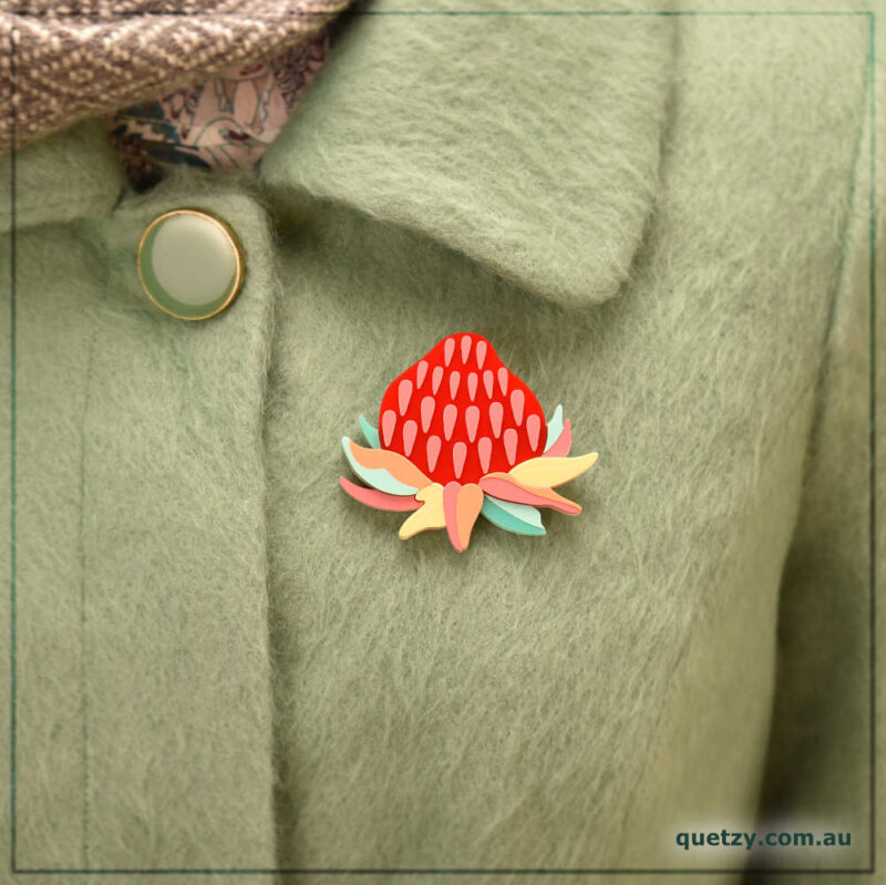 Stylised Mainland Waratah acrylic brooch in pastel colours. Designed and handmade by Quetzy.