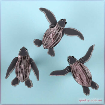 Tiny Leatherback Turtle Hatchlings dashing from their nest. This acrylic brooch three-set designed and created by Quetzy.