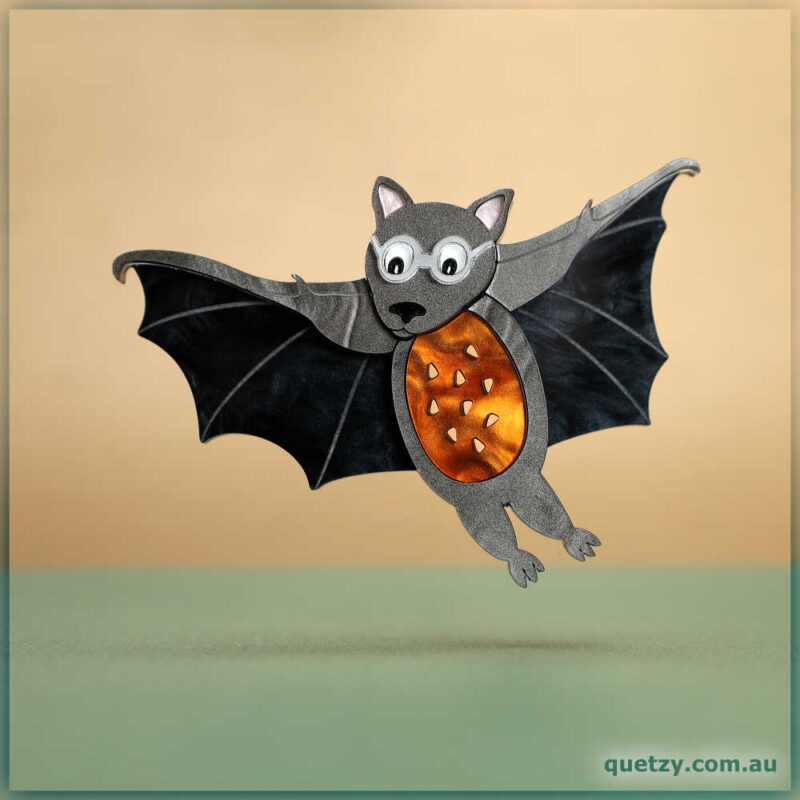 Flying Fruit Bat acrylic brooch gliding in for some native Eucalypt nectar. Yum! Designed and crafted by Quetzy.
