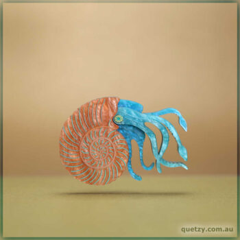 Prehistoric Ammonite brooch in joyful complimentary ripple glitter acrylics. Designed and crafted by Quetzy.