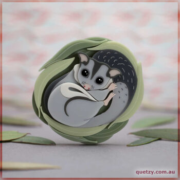 What could possibly be more adorable than a Sugar Glider snuggled up in it's nest? This brooch is presented in complimentary tones and delicate colour layering. Designed and hand crafted by Quetzy.